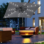 '-Outsunny 9' x 7' Patio Umbrella Outdoor Table Market Umbrella with Crank, Solar LED Lights, 45Â° Tilt, Push-Button Operation, for Deck, Dark Gray - Outdoor Style Company