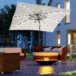 '-Outsunny 9' x 7' Patio Umbrella Outdoor Table Market Umbrella with Crank, Solar LED Lights, 45Â° Tilt & Push-Button Operation, for Deck, Pool, White - Outdoor Style Company